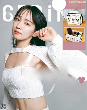 A woman in a gray dress on a magazine cover.